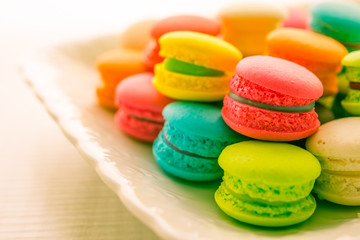 Colorful france macarons on white vintage dish - Vintage tone