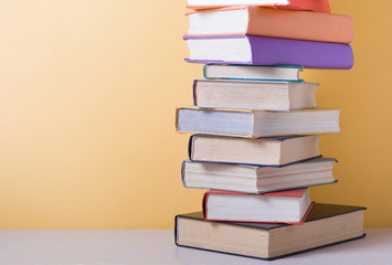 Stack of colorful books. Education background. Back to school. Copy space for text.