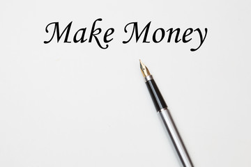 Fountain pen on make money text