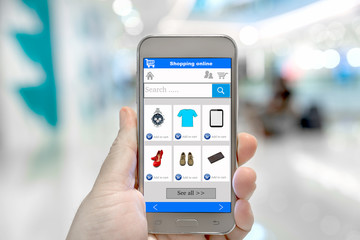 Smart phone online shopping in man hand. 