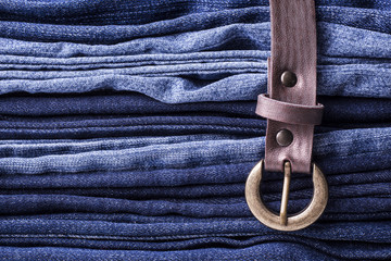 Jeans background. Texture. Leather belt