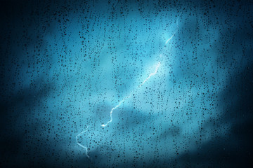 Raindrops on a window during bad, rainy weather.