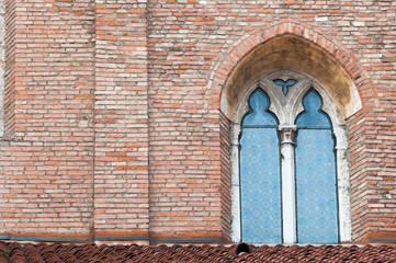 Pointed window at one side of the gothic cathedral Santa Maria Annunciata in Vicenza