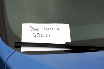 Note on a windscreen about being back soon