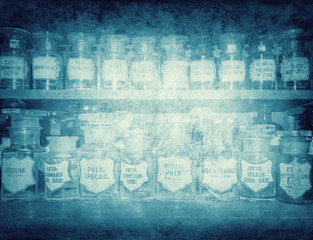 Bottles on the shelf in old pharmacy. Good background on the topic of old medicine.