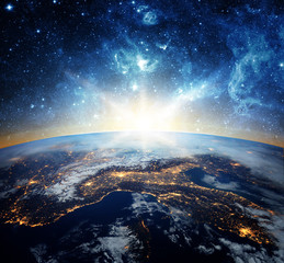 Earth and galaxy. Elements of this image furnished by NASA.