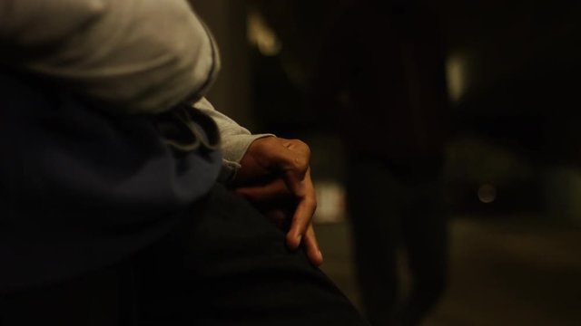  Hands showing a covert drug deal, in slow motion
