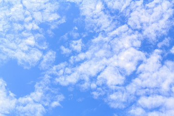 Obraz premium Blue sky background with white clouds. The vast blue sky and clouds sky on sunny day. White fluffy clouds in the blue sky.