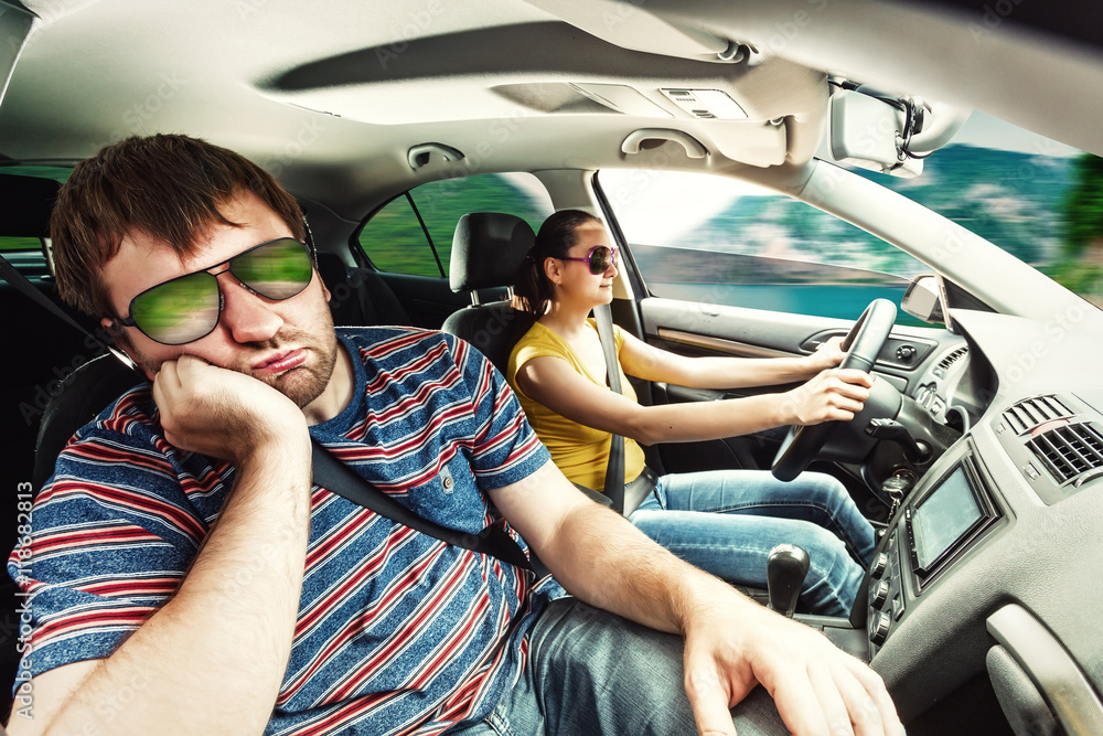 Wall mural couple travelling by car