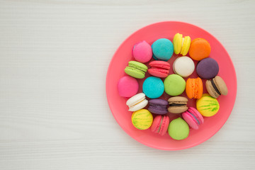 Colorful france macarons on white table background