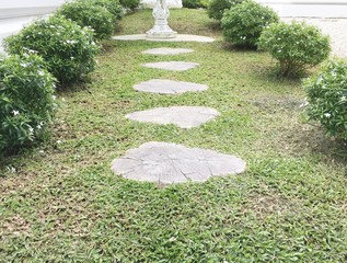 walkway to guardian spirit house or shrine of the household god in white temple , Thailand.