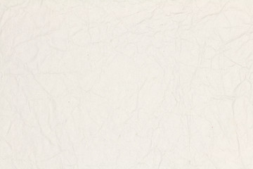 Recycled crumpled light brown paper texture or paper background for design with copy space for text or image.