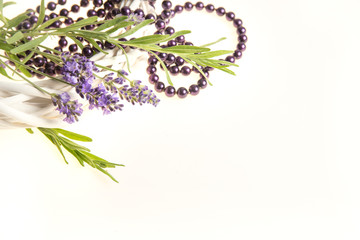 romantic background of with branches of blooming lavender and pearl necklaces isolated on white 