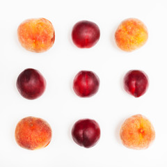 ripe nectarines and peaches arranged in square