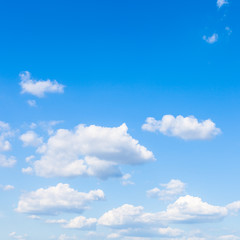 small white clouds in blue sky in sunny day