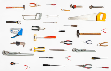 many hand tools arranged on white