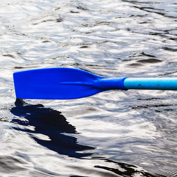 paddle over the water during rowing boat