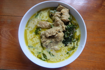 green curry chicken in coconut milk in bowl

