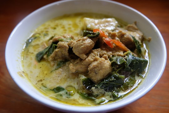 green curry chicken in coconut milk in bowl

