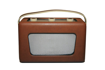 Old vintage 1950s radio with faux leather front and grille isolated on a white background
