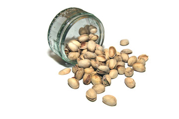 Glass bowl/Ramekin of Salted Pistachios on isolated white background