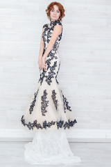 Portrait of a beautiful girl in a beautiful dress with patterns by Parliament