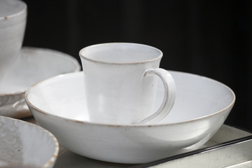 Fototapeta na wymiar white cups and saucers handmade