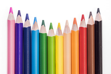 Colored pencils on white background