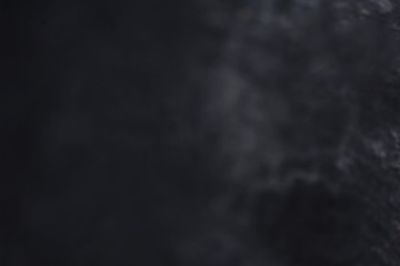 Black Grunge textured background with scratches.