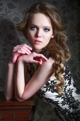 Portrait of a beautiful girl in a beautiful dress with patterns by Parliament