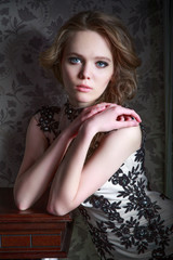 Portrait of a beautiful girl in a beautiful dress with patterns by Parliament