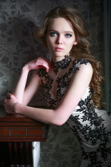 Portrait of a beautiful girl in a beautiful dress with patterns by Parliament