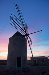 Fomentera, Isole Baleari: vista del mulino Moli Vell de La Mola al tramonto il 2 settembre 2010. Il mulino della Mola fu costruito nel 1778