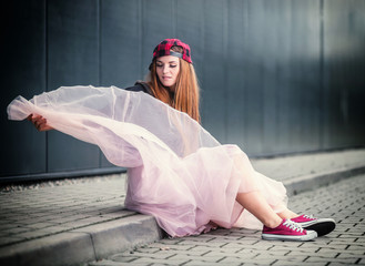 Trendy beautiful long haired girl posing, hip hop fashion