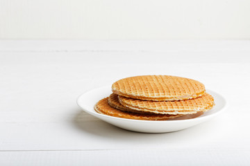 Round wafers in a white plate