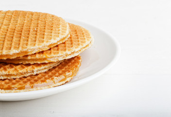 Closeup round wafers in a white plate