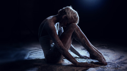 Fototapeta premium Portrait of beautiful woman lying on the floor with flour