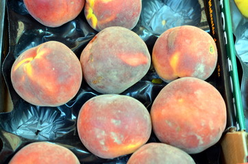 fresh large peaches in a basket