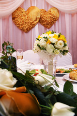 Wedding bouquets on table at reception dinner party