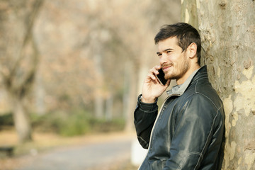 Handsome Man Talking On Mobile Smart Phone Outdoor