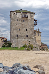 Amazing view of Beach and Medieval tower in  Ouranopoli, Athos, Chalkidiki, Central Macedonia, Greece 