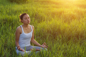 Yoga in the city: beautiful young fit woman wearing sportswear m