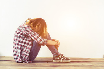 Woman life concept: sad woman hug her knee and cry