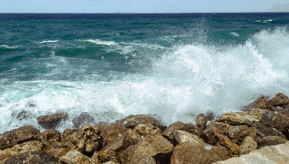 A big wave hits the rocks
