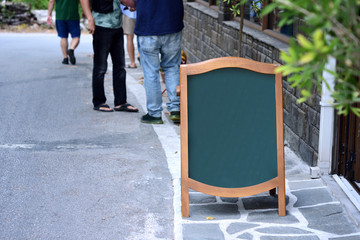 Empty restaurant blackboard on street