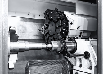 industrial metal work bore machining process by cutting tool on automated lathe