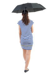 young woman in dress walking under an umbrella. Rear view people collection.  backside view of person.  Isolated over white background. Swarthy girl in a checkered dress goes under the umbrella