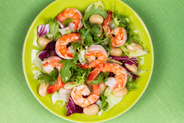 Shrimp and white bean salad. View from above, top studio shot