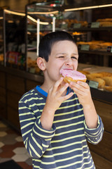 Child eating doughnut