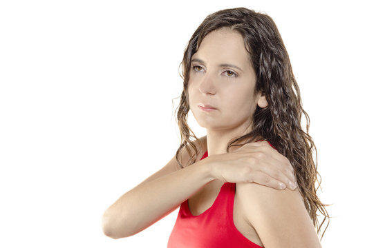 Woman with shoulder pain or stiffness, her hand in her shoulder.